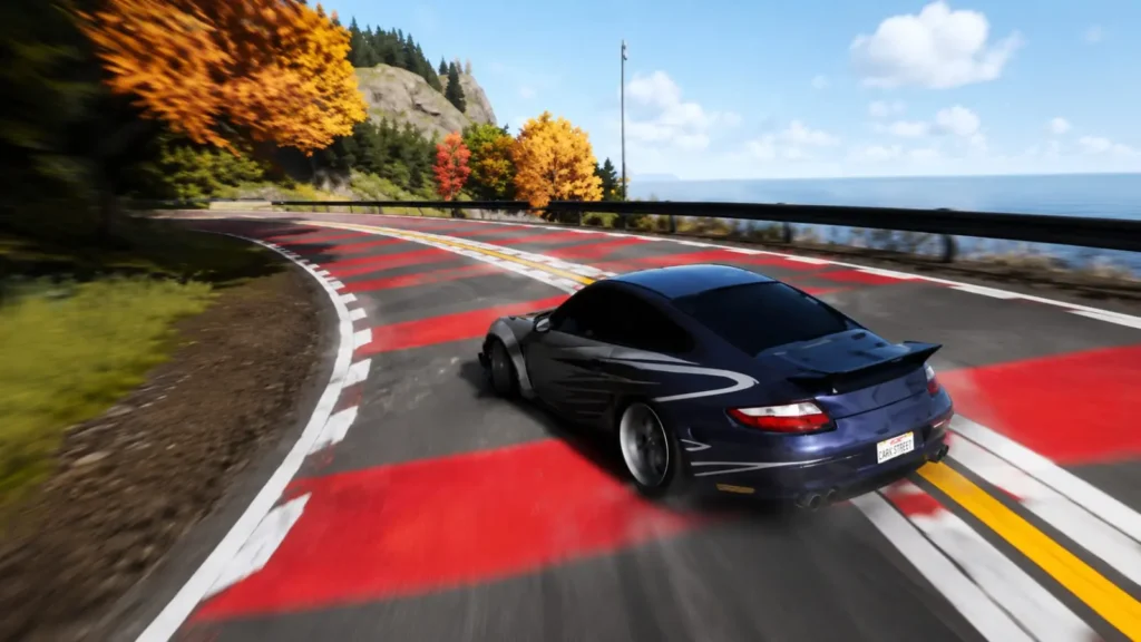 Home 7 Porsche 911 performing a high-speed drift on a winding coastal road in CarX Street.